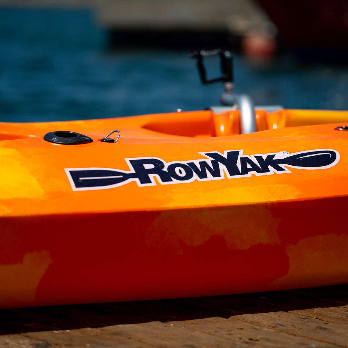 RowYak logo detail on the sunset-colored kayak hull