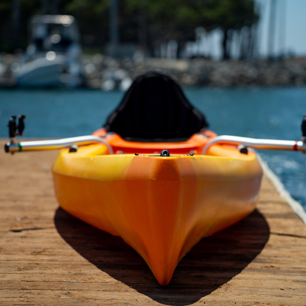 Front bow view of a sunset RowYak tandem kayak at a marina