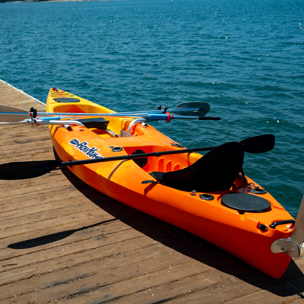 Sunset RowYak tandem kayak with rowing oars and paddles attached