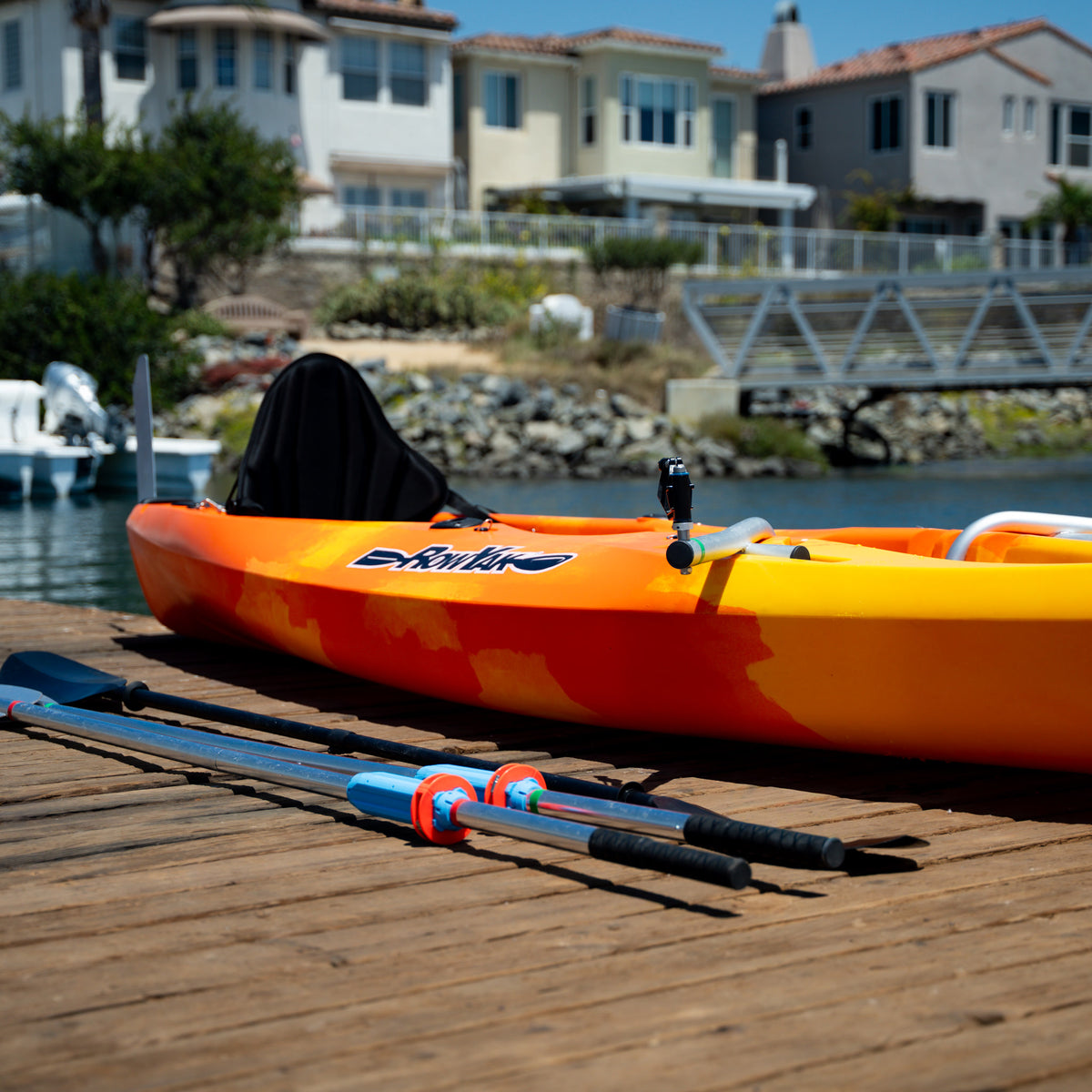 Elevated side view of a sunset RowYak kayak beside the water