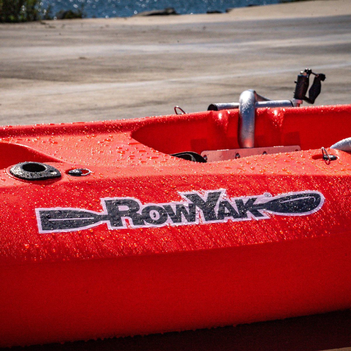 RowYak logo and red hull detail with water droplets