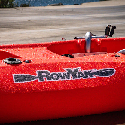 RowYak logo and red hull detail with water droplets